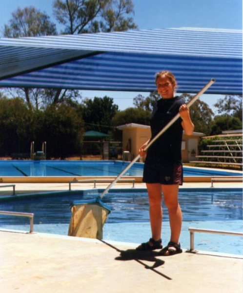 Bianca cleaning the pool