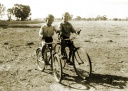 Riding the bikes Fred and George Jones, Koonda. 1950s